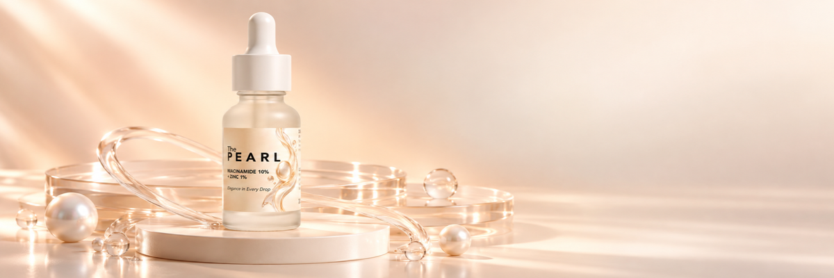 THE PEARL Niacinamide Serum in a warm pearl and champagne setting